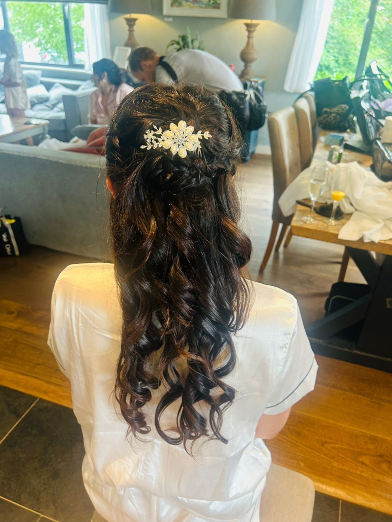 Dark curls with a jewelled hairpiece